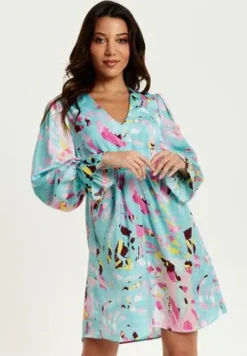Women Liquorish Abstract Print Mini Dress With Open Back And Long Sleeves