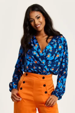 Women Liquorish Abstract Print Wrap Top In Pink Orange And Blue